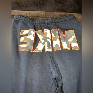 Nike Sportswear Club Fleece Joggers (Camo “NIKE” on front)